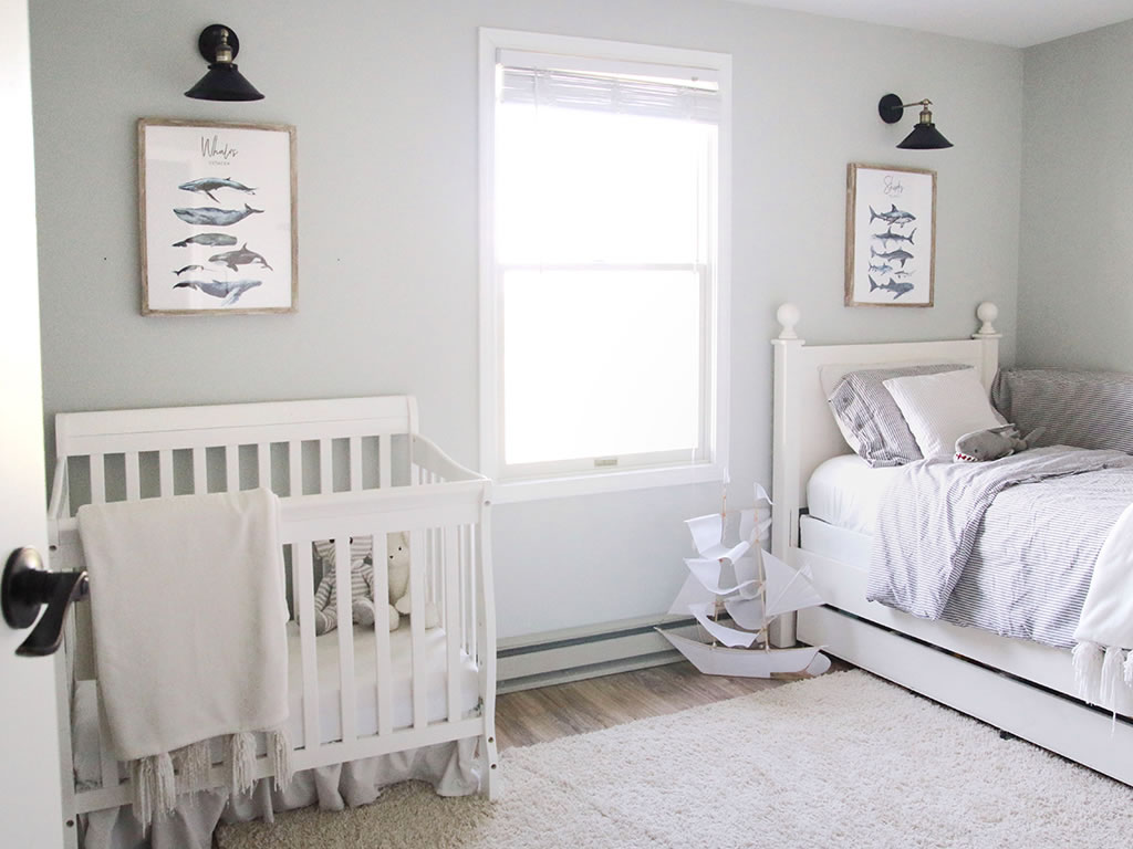 crib and bed in small room